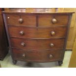 A Victorian mahogany bow fronted bedroom chest of two short over three long graduated drawers