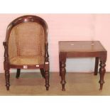 A 19th century mahogany child's bergere high chair with horseshoe shaped back raised on turned