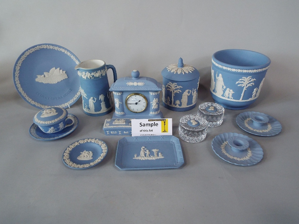 A collection of Wedgwood blue ground Jasperwares including a pair of cachepot, further cachepot,