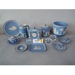 A collection of Wedgwood blue ground Jasperwares including a pair of cachepot, further cachepot,