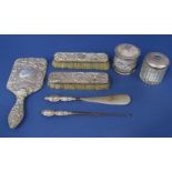 A collection of 19th century and later dressing set items comprising two brushes, hand mirror, scent