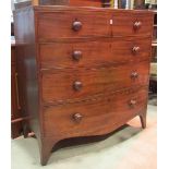 An early 19th century mahogany bow fronted caddy top bedroom chest of two short and three long