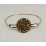 Half sovereign dated 1909, mounted in a yellow metal bangle stamped 'REG.DES.ARP', 9.5g