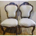 A pair of good quality 19th century side chairs, with carved and gilded frames, scrolling and