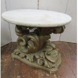 A 19th century carved timber scroll, raised on serpentine base with gilded finish supporting a