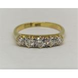 Good 18ct graduated five stone diamond ring, centre stone 0.15cts approx, size M/N, 3g