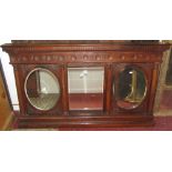 A 19th century carved oak overmantle incorporating three mirror plates with reeded column supports