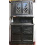 A small rustic cottage pine dresser, the base enclosed by two panelled doors, the upper section by