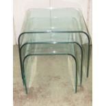 A nest of three good quality graduated, light green tinted moulded glass occasional tables, possibly