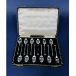 Good quality cased set of twelve seal top coffee spoons, with acanthus trails to the back of the