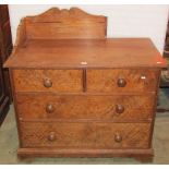A Victorian pitch pine bedroom chest of two short over two long drawers with turned knob handles
