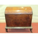 A Victorian walnut and straw work marquetry box with arched top, raised on a simulated marble plinth