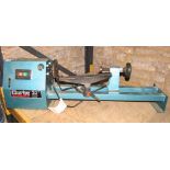A Clarke 20 inch woodworking lathe with attachments