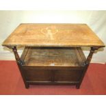 An early 20th century oak monks bench with panelled top and box base with hinged lid 81 cm wide x 49
