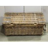 A vintage wicker hamper, the hinged lid with galvanised fittings and rope twist handles