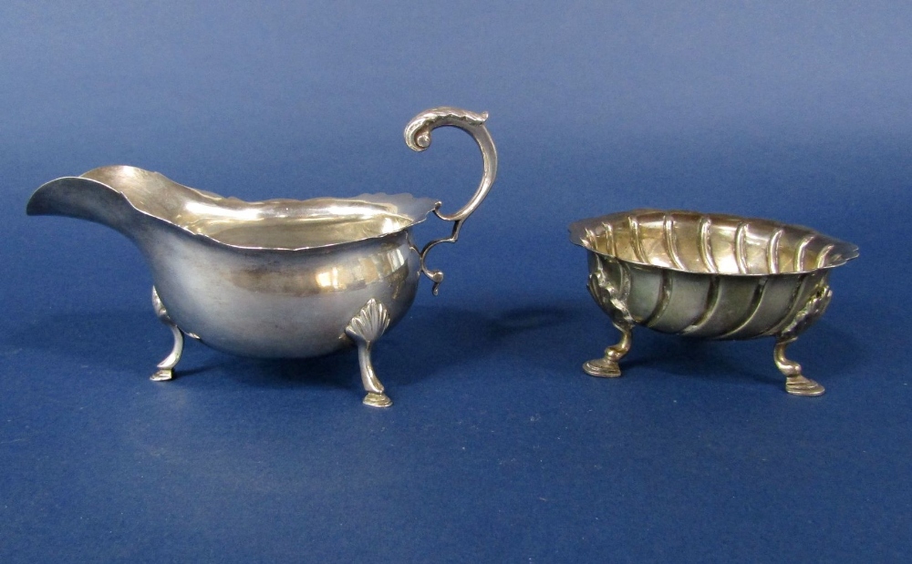 A good quality cast silver bon bon dish with spiral lobed embossed decoration and scallop shell hoof