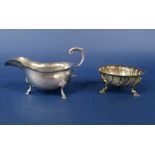 A good quality cast silver bon bon dish with spiral lobed embossed decoration and scallop shell hoof