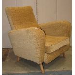 An armchair with shaped outline upholstered finish, loose seat cushion raised on splayed beechwood