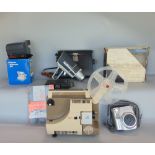 A collection of vintage camera equipment to include a boxed folding Brownie, a Super 8 projector,