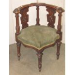 A Victorian corner chair, the shaped and moulded rail back with simple carved detail, pierced
