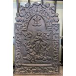 A small 19th century cast iron fire back of stepped arched form with raised classical figures and
