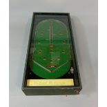 Vintage bagatelle type game 'The Wizard Pin game' in solid green case