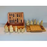 A good quality miniature games board with slim drawers fitted with chess pieces together with a