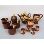 A collection of David Cleverly Devon Pottery mouse wares comprising a teapot, milk jug, covered