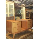 A Meredew pale oak drop well dressing table, circa 1960, the central mirror flanked by four