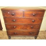 A 19th century mahogany bedroom chest of two short over three long graduated drawers, raised on