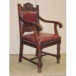 A set of three mahogany open elbow chairs with faux leather upholstered seats and back pads