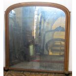 A Victorian gilded overmantle mirror of arched form, 110 cm in height