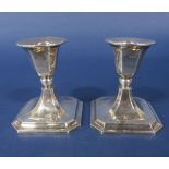 A pair of early 20th century silver squat faceted candlesticks, maker S G J, Birmingham 1919, 10