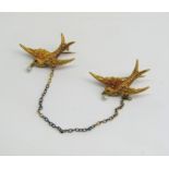 Victorian 15ct double swallow brooch, each beak hung with a seed pearl and with cabochon garnet
