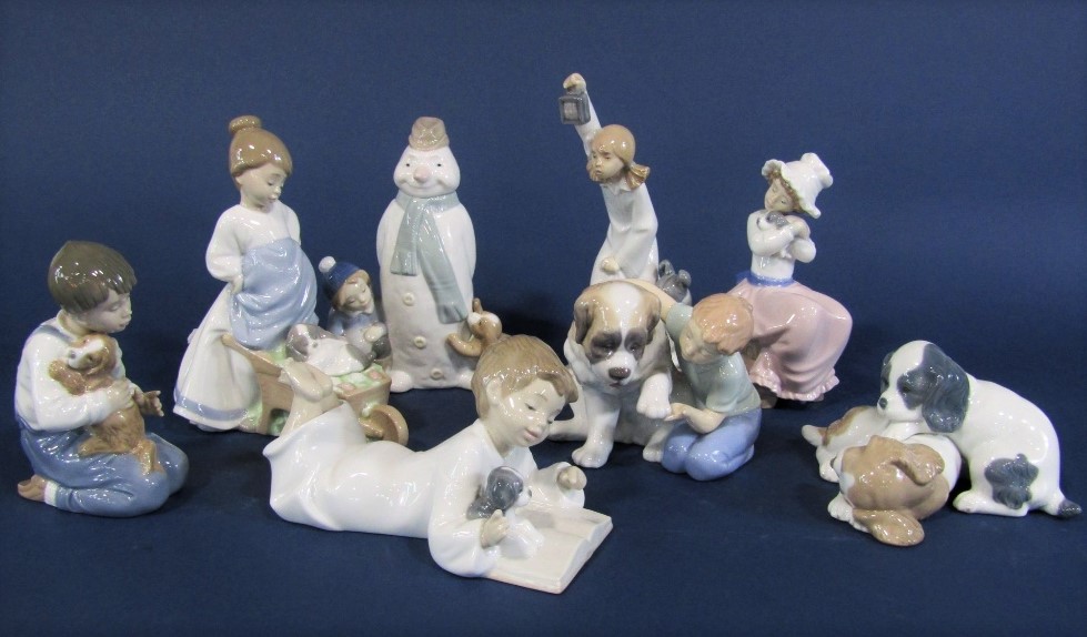 A collection of seven Nao figure groups all showing children with their pets, together with a