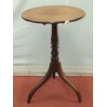 A small Georgian mahogany snap top table, the circular top 50cm diameter, raised on a turned