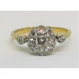 Attractive early 20th century 18ct diamond cluster ring, size J/K, 2g