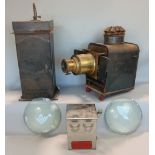 A good quality vintage tin cased magic lantern with brass fittings together with two large convex