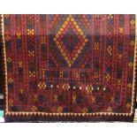 Good Kelim carpet in a warm colourway, upon a dark ground, 320 x 200cm