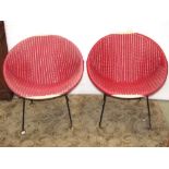 A pair of 1950/60s low cone shaped basket type weave chairs raised on steel frames and adjustable