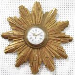 Good French carved gilt wood sunburst cartel type wall clock, with convex glass and enamel dial,