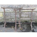 A pair of old iron work trestles