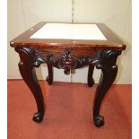 A small heavy rosewood occasional table of square cut form, with inset white marble top, raised on