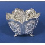 Eastern white metal faceted flower shaped bon bon dish upon scrolled serpent feet, the panels