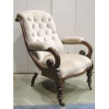 A Victorian drawing room chair with upholstered seat, arm pads and scrolled button back, scrolled