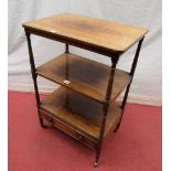 A small Regency rosewood three tier wat-not, with frieze drawer on turned supports, 53cm wide