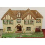 A pre war dolls house, the twin gabled property with painted finish (ripe for restoration), 73 cm