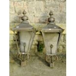 A pair of Victorian style brass framed exterior lanterns, with square tapered hoods and raised