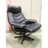 A mid to late 20th century swivel and adjustable lounge chair, with black soft stitched leather