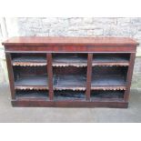A dwarf mahogany floorstanding three sectional open bookcase with adjustable shelves, 165 cm long